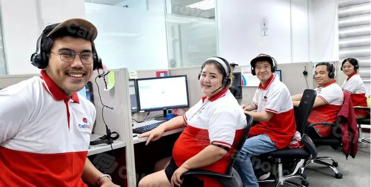 Callnovo customer support agents wearing headsets at workstations for bilingual guest support coverage