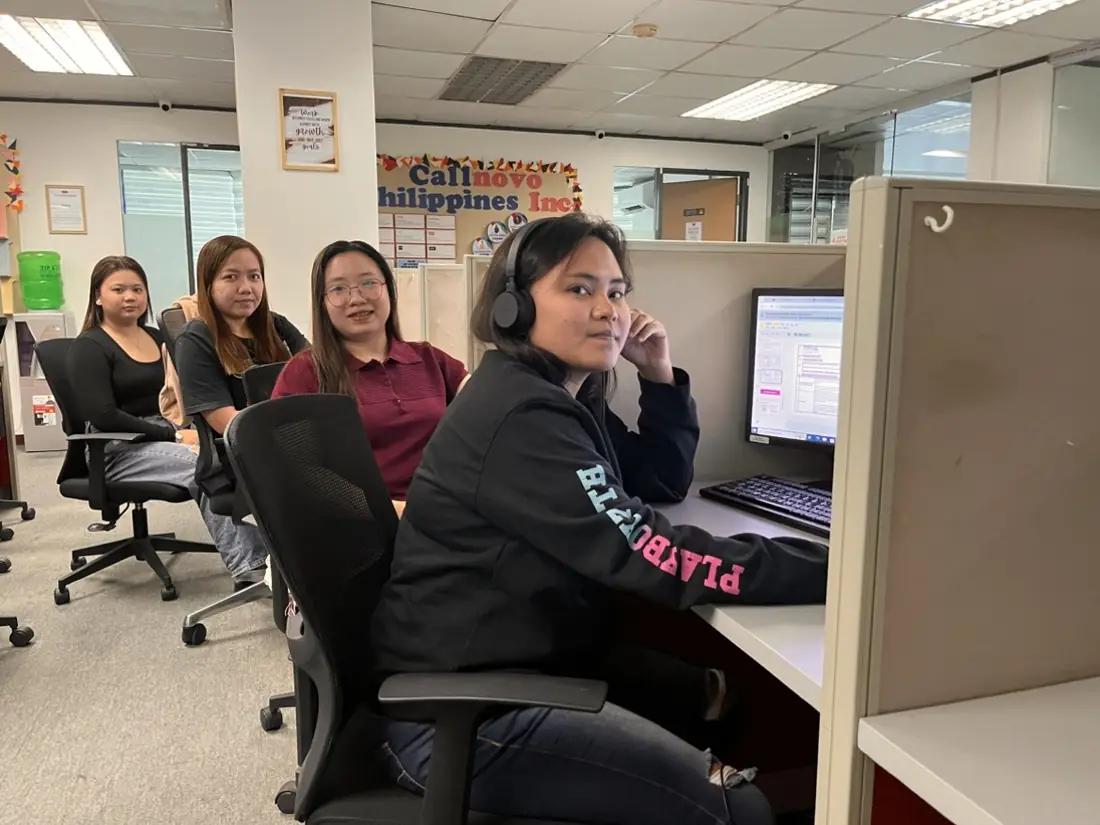 Callnovo support agents at a compliance-certified operations center, trained on data-privacy requirements before going live