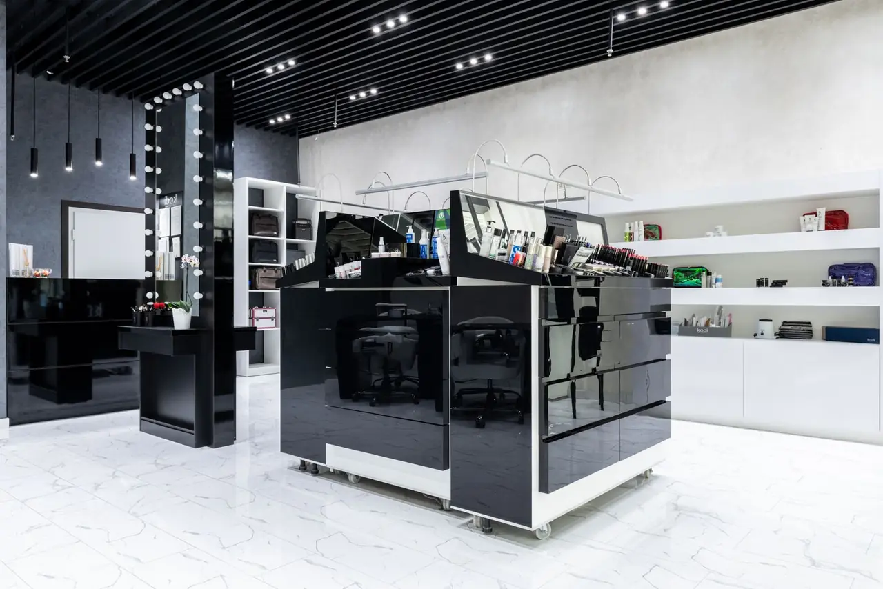 Modern cosmetic store with sleek display units and shelving, showcasing products in a stylish interior.